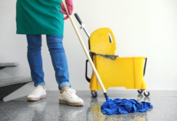 Women mopping floor.